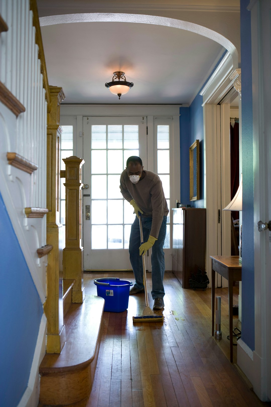 home-services-01 This African-American man was in the process of damp-mopping his home’s entrance way. In this way airborne particulates including dust and pollen, could be removed from the inside of his home, thereby, reducing the detrimental effects these substances have upon the respiratory system of his family members. These irritants can sometimes result in sinus infections, and asthma.